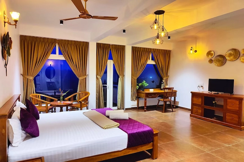 Elegantly styled resort bedroom suite at The Highlander luxury villa in Vagamon Kerala