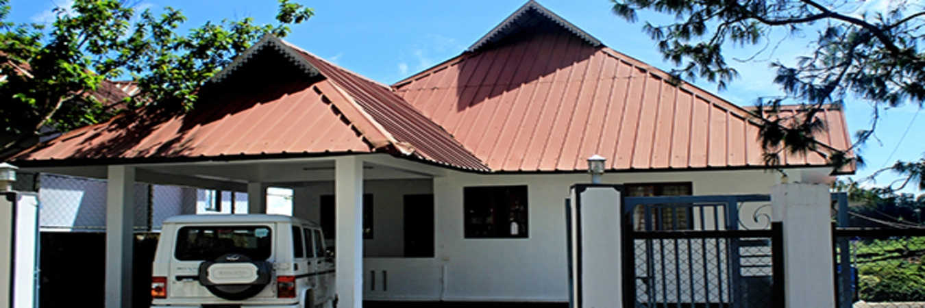 Exterior view of cottage suites with tiled red roofs at Vaga Nakshathra Suites Vagamon
