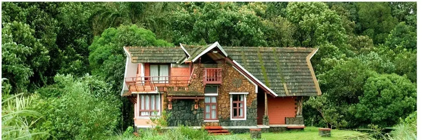 Picturesque cottage villa nestled amidst lush green hills at Vagamon Heights in Thankakanam Estate