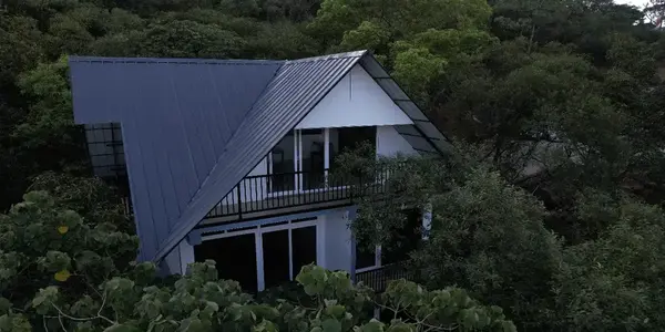 Modern luxury cottage surrounded by dense forest at Vanaheim Resort Vagamon