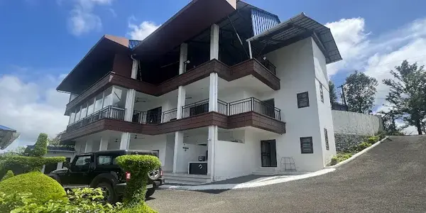 Exterior view of modern multi-story homestay building at Moon Palace Kuttikanam