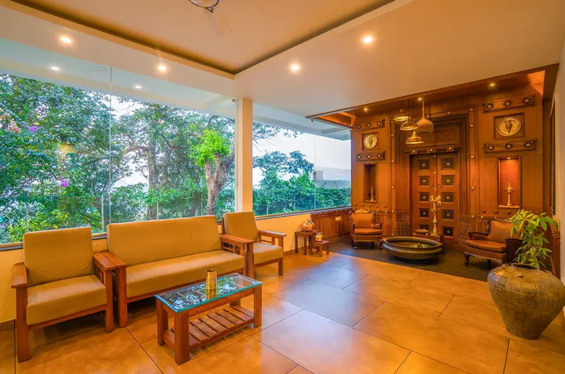 Spacious resort lobby lounge with panoramic green views at Winter Vale Green Stay