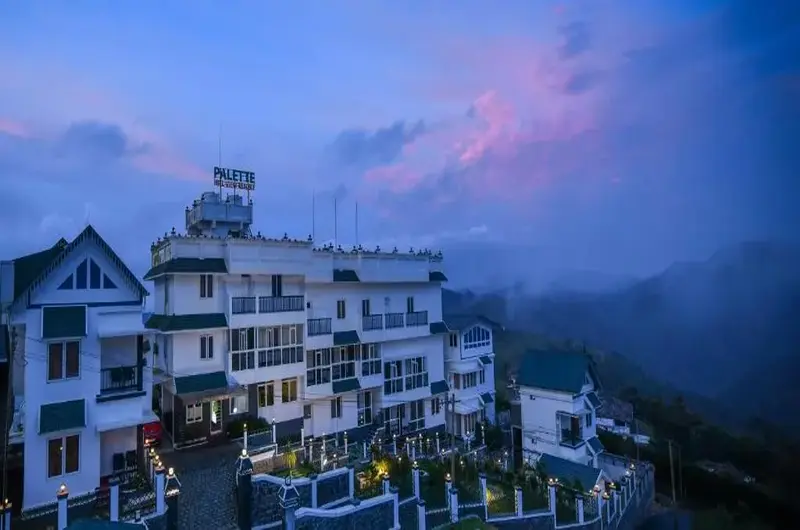 Exterior view of Palette Hill View Resort illuminated at dusk