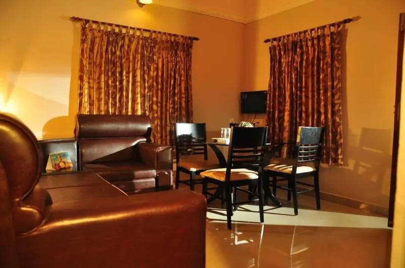 Cozy indoor seating lounge featuring plush leather armchairs and warm ambient lighting