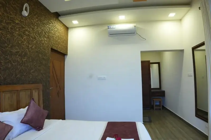 Modern guest bedroom suite with comfortable beds and minimalist interior decor at Vaga Mist Resort