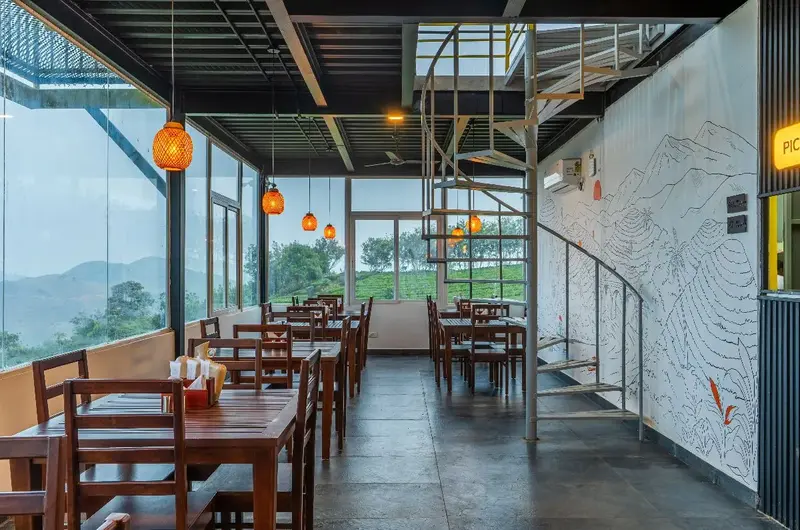 Stylish restaurant seating area with a contemporary architectural design in Vagamon.