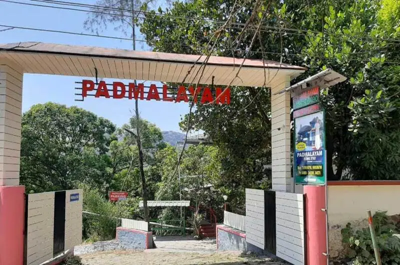 Gated entrance arch with Padmalayam sign board leading into the homestay property in Vagamon