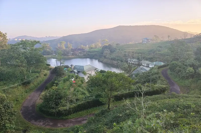 Panoramic elevated view of green mountain valley and rolling hills at Orion County Vagamon