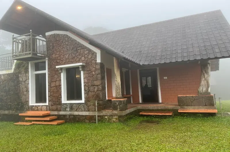 Exterior view of modern stone cottage rooms at Vagamon Heights in misty Vagamon hills