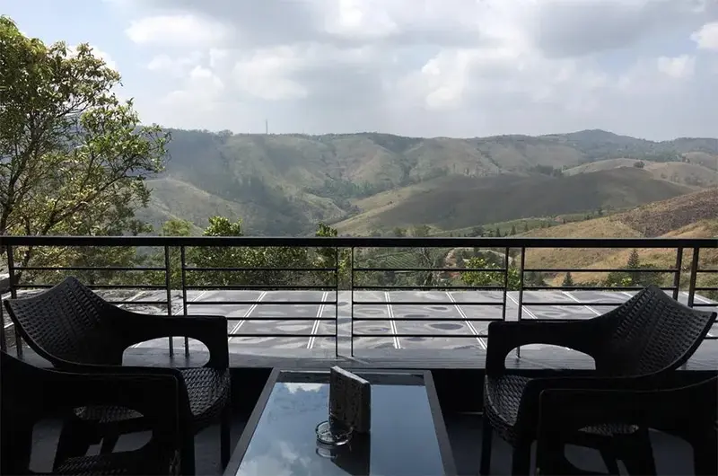 Private balcony deck with comfortable outdoor seating overlooking mountain landscape at Beyond Pines Vagamon