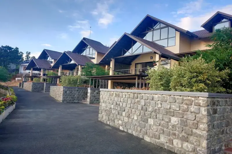 Luxury cottage exterior architecture and stone paved courtyard at Beyond Pines Vagamon