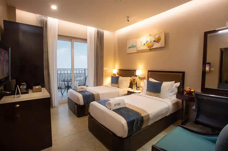 Spacious guest bedroom suite featuring twin beds and modern room decor at Le Crown Hotel Vagamon