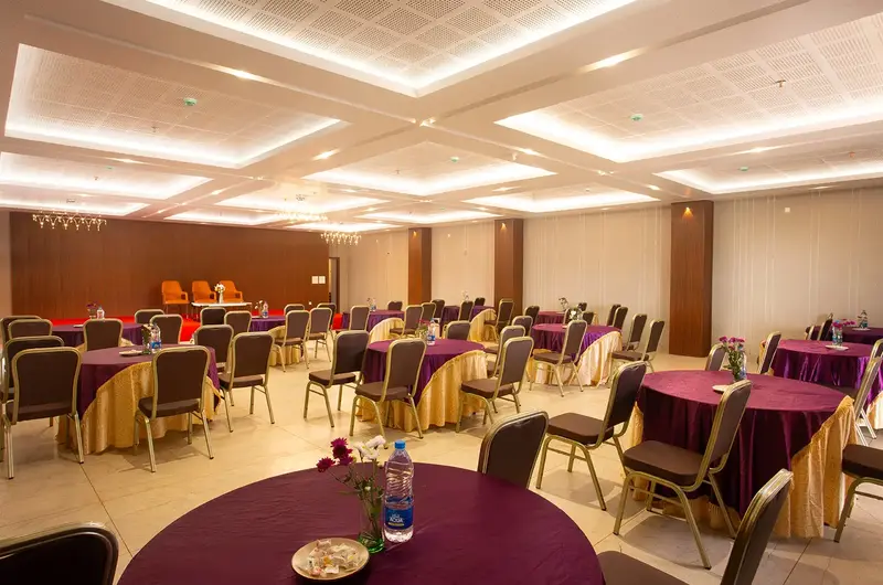 Spacious banquet hall and event venue setup with elegant seating at Le Crown Hotel Vagamon