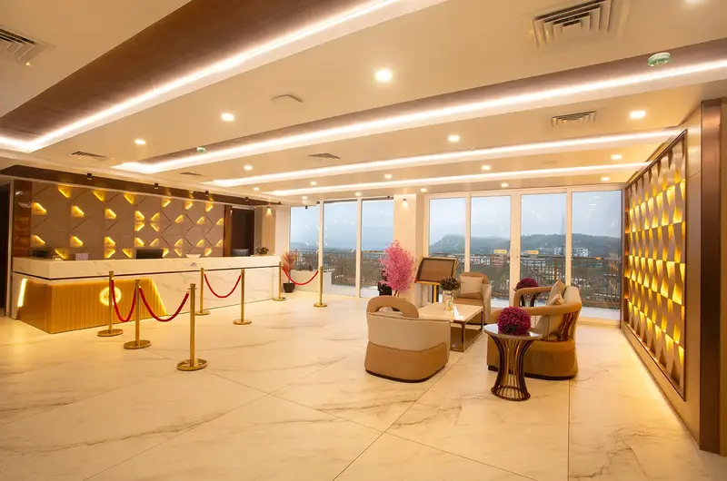 Luxurious hotel lobby and reception lounge with warm lighting at Le Crown Hotel Vagamon