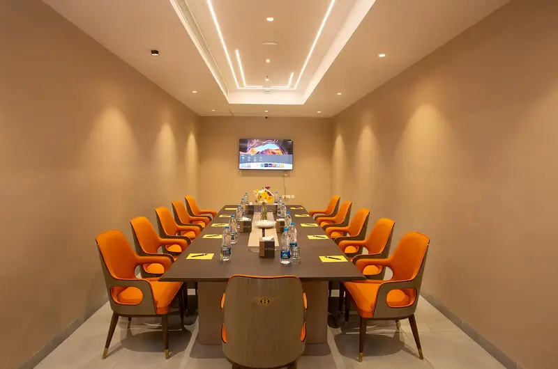Modern conference boardroom with executive seating and lighting at Le Crown Hotel Vagamon
