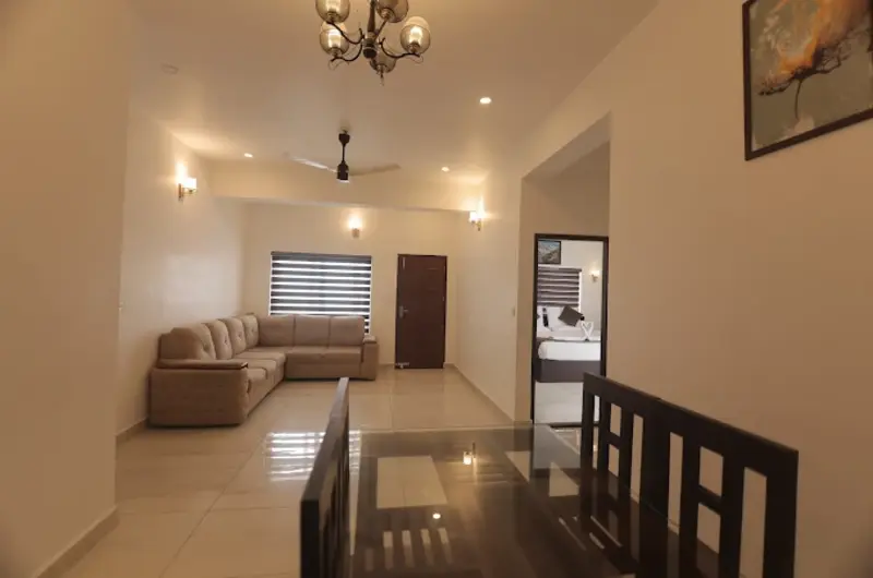 Spacious resort lounge interior with comfortable seating at Himasailam Resort Vagamon