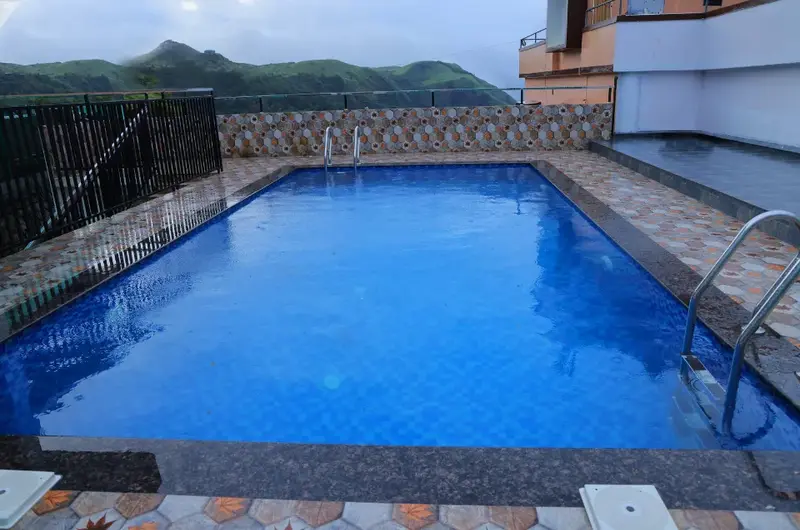Outdoor swimming pool at Himasailam Resort Vagamon