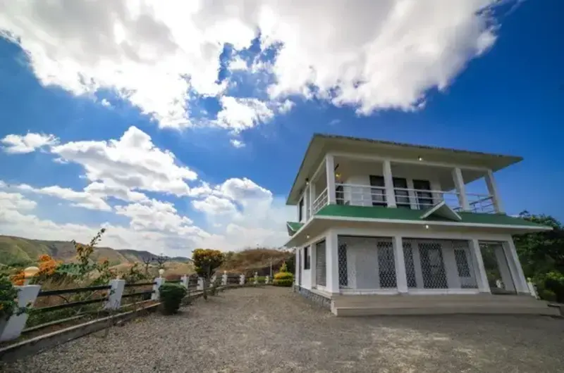 Front entrance courtyard and paved driveway view of homestay at The Nest Homestay Vagamon