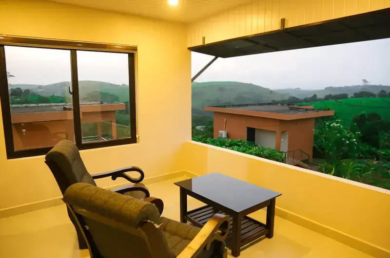 Resort room balcony seating deck with panoramic hill views at Cee Cee Grand Resort Vagamon
