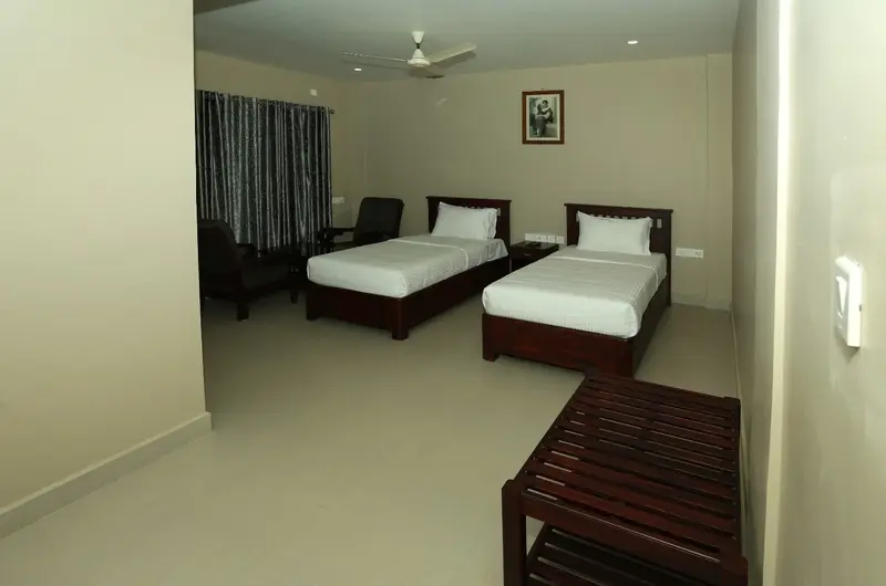 Spacious family guest room with two beds and clean interior decor at Cee Cee Grand Resort Vagamon