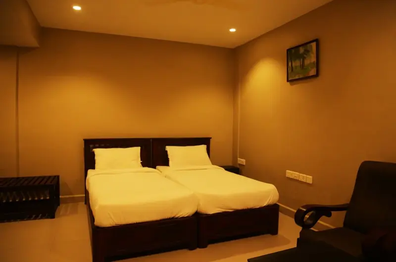 Cozy resort bedroom interior with comfortable double bed at Cee Cee Grand Resort Vagamon