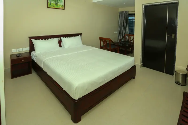 Cozy resort bedroom interior featuring modern bedding and ambient lighting at Cee Cee Grand Resort Vagamon