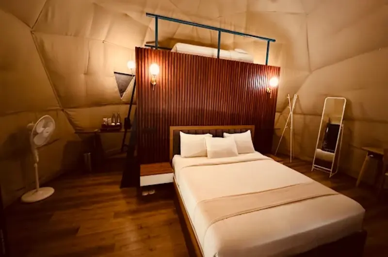 Cozy interior view of geodesic dome bedroom with double bed and ambient lighting at Willmount Geodesic Domes Vagamon