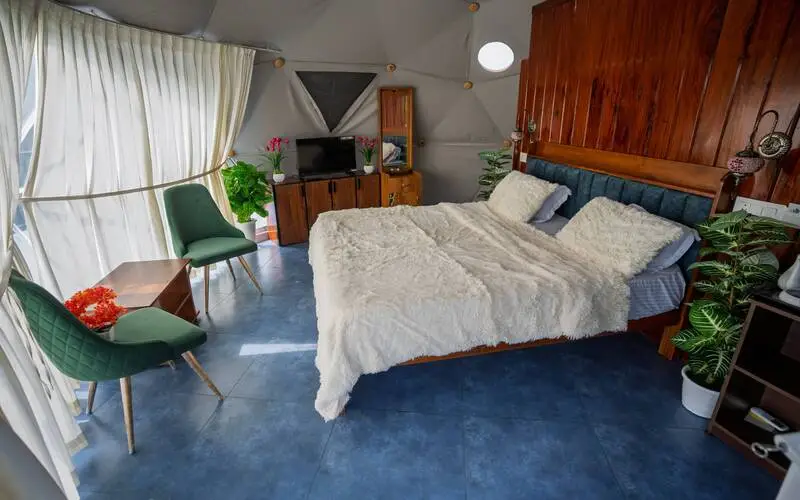 Spacious luxury glamping dome bedroom interior with large window views at Pendora Glamps Vagamon