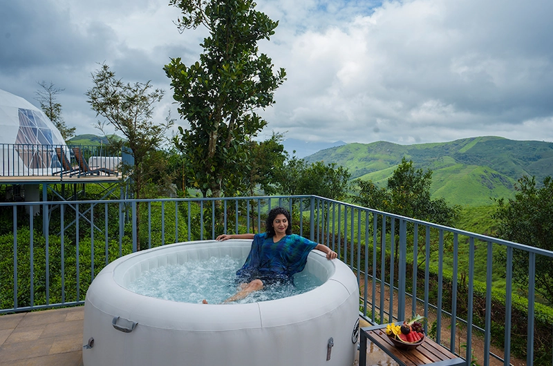 Outdoor jacuzzi plunge pool on private viewing deck with mountain backdrop at Monticle Glamps Vagamon