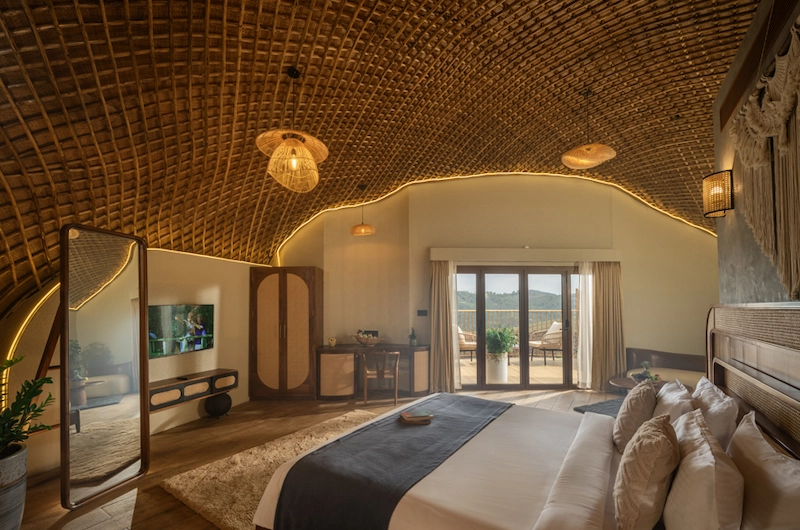 Cozy glamping dome bedroom interior with double bed and natural wood paneled wall at Monticle Glamps Vagamon