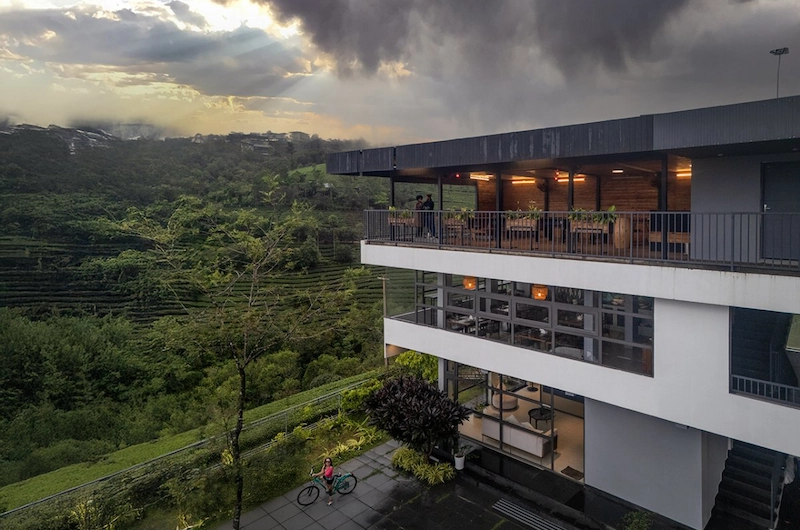 Luxury resort building architecture overlooking misty hills at Monticle Glamps Vagamon
