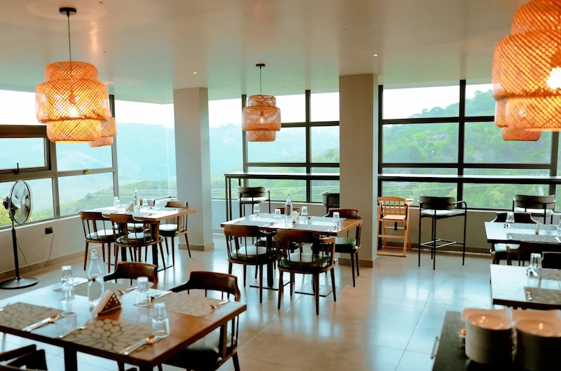 Resort dining area interior with warm pendant lighting at Monticle Glamps