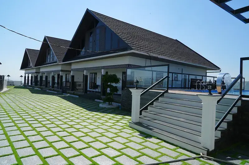 Paved outdoor courtyard and resort building architecture