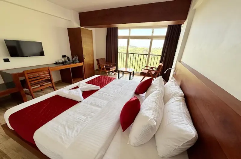 Cozy resort bedroom with king bed and scenic window view at Vanaheim Resort Vagamon