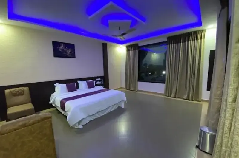 Luxury resort bedroom suite featuring blue ambient ceiling lighting at Mountain Mist Resort Vagamon