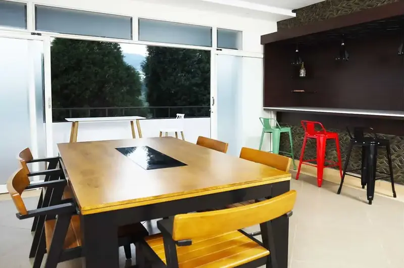 Modern indoor dining space with wooden tables at Mountain Mist Resort Vagamon