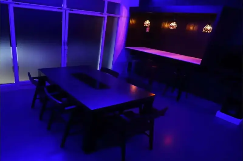 Ambient blue-lit indoor lounge seating area at Mountain Mist Resort Vagamon