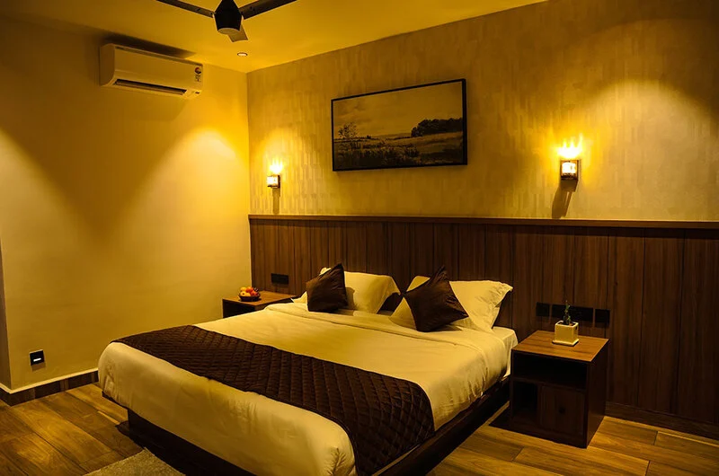 Luxury guest bedroom with warm ambient lighting at Olga Resorts Vagamon