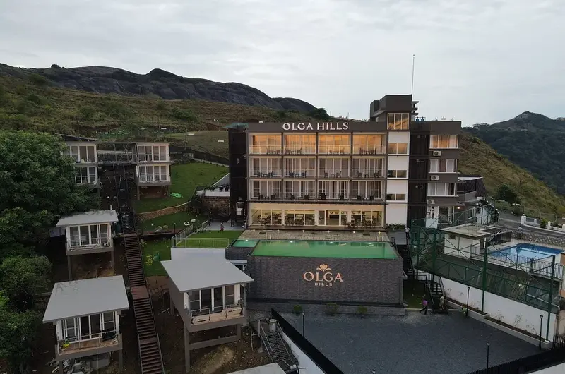 Exterior view of multi-story luxury hotel building at Olga Resorts Vagamon