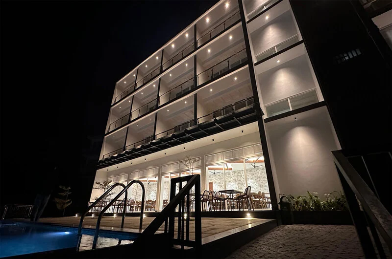 Infinity swimming pool overlooking foggy mountain valley at Olga Resorts Vagamon