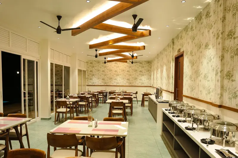 Modern indoor dining room and restaurant with warm lighting at Olga Resorts Vagamon