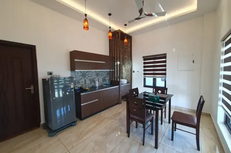 Modern resort room interior featuring counter seating and workspace desk
