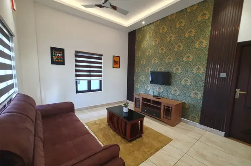 Spacious modern resort suite living room with sofa and TV setup at The Felmel Resort Vagamon