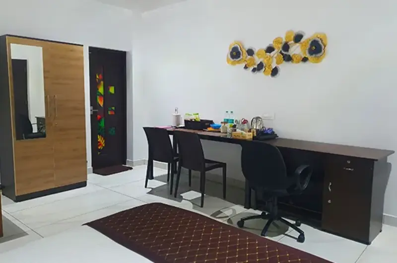 Modern resort room interior featuring counter seating and workspace desk