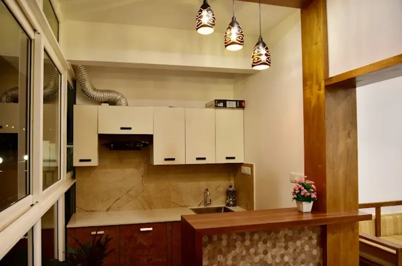 Modern in-room kitchenette and dining counter setup inside a suite at ODMOR Resort Vagamon