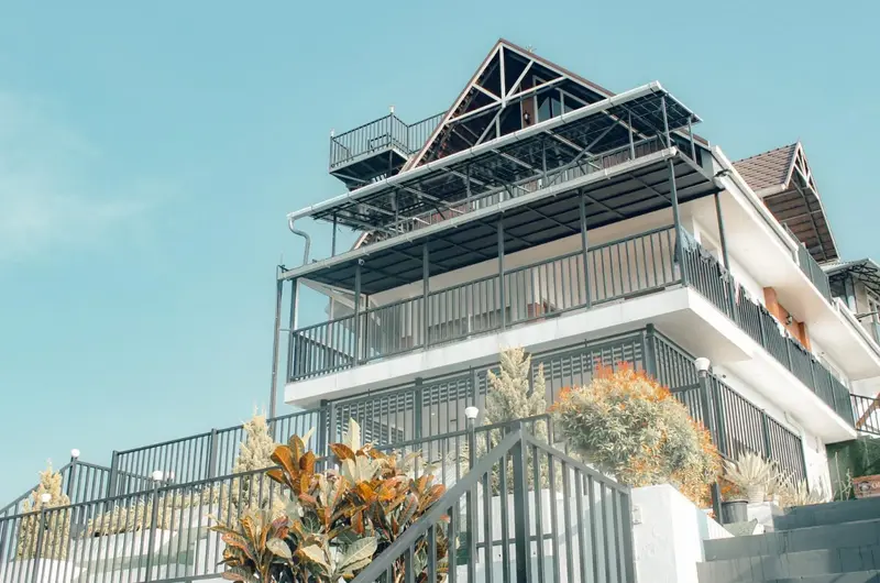 Modern multi-story building structure at ODMOR Resort with balcony views in Vagamon