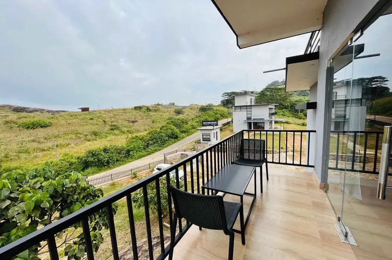 Private balcony railing at Rock View Resort overlooking Vagamon valley