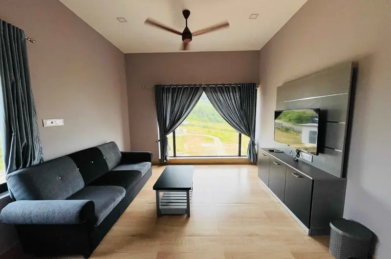 Spacious luxury suite interior with sofa seating and TV at Rock View Resort