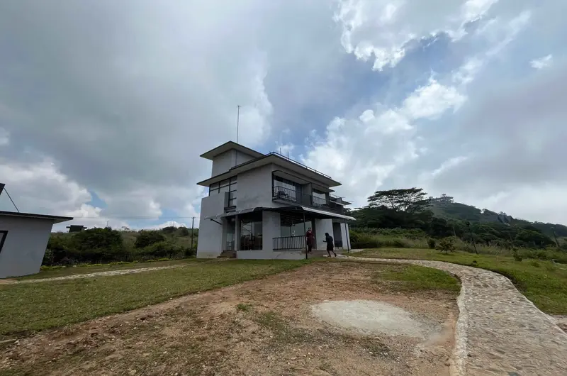 Scenic hilltop view of Rock View Resort building surrounded by Vagamon landscape