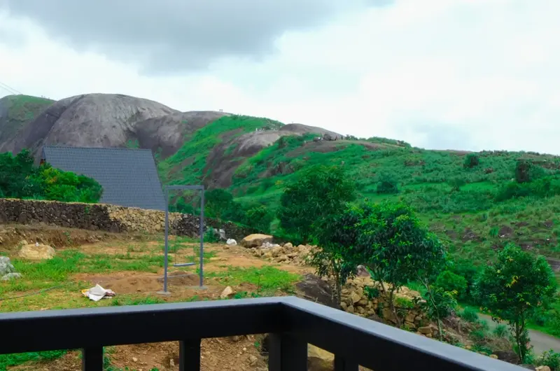 Lush green mountain and hill view from Rock View Resort balcony